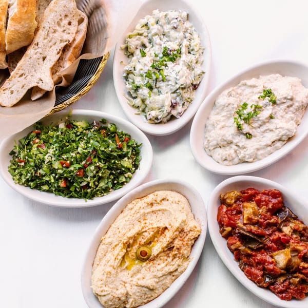 Alihan's Mediterranean Cuisine's mezze platter with hummus, baba ghanoush, tabbouleh, and other dips.