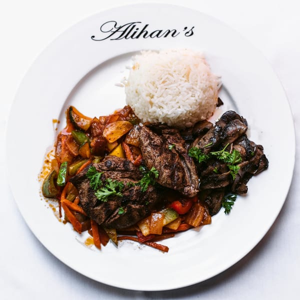 Alihan's Mediterranean Cuisine plate with grilled meat, sautéed vegetables, mushrooms, and rice.